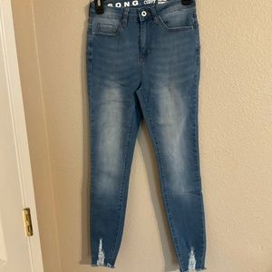 Distressed ankle jeans